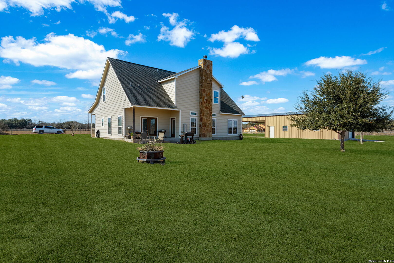 932 County Road 761 Devine, TX 78016 - Photo 37 of 47 a view of a house with a big yard