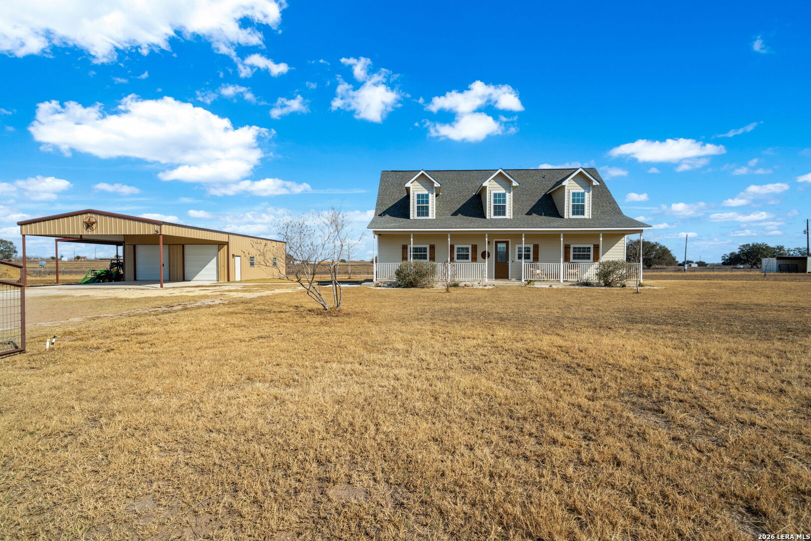 932 County Road 761 Devine, TX 78016 - Photo 4 of 47 a front view of a house with a yard