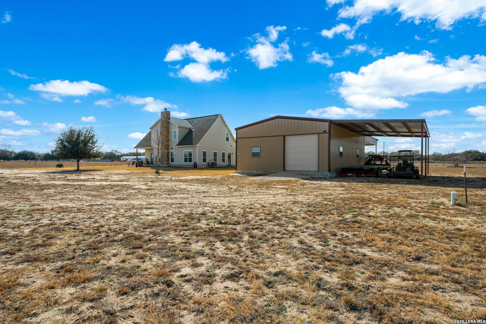 932 County Road 761 Devine, TX 78016 - Photo 42 of 47 a view of a house with a yard