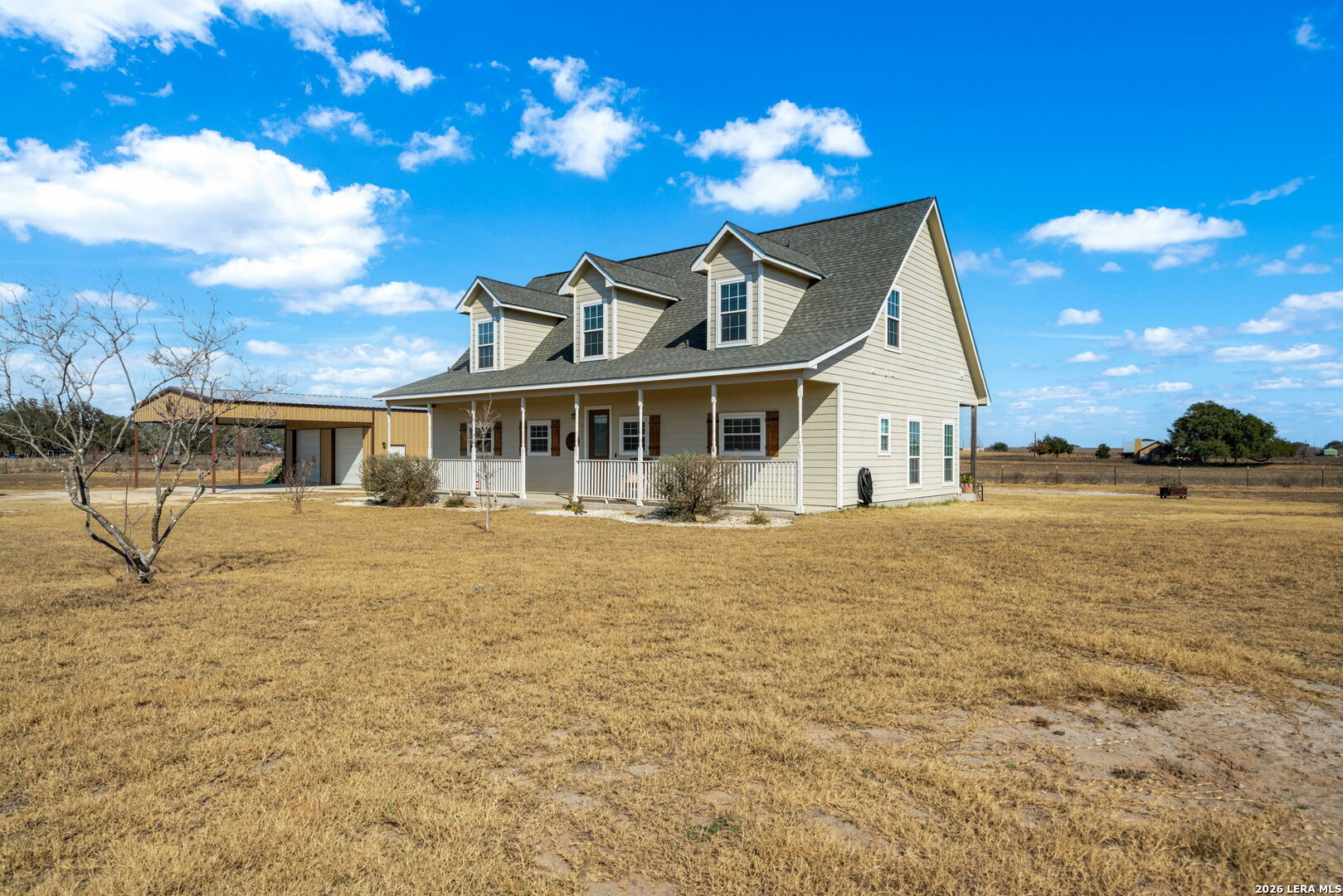 932 County Road 761 Devine, TX 78016 - Photo 5 of 47 a front view of a house with a yard