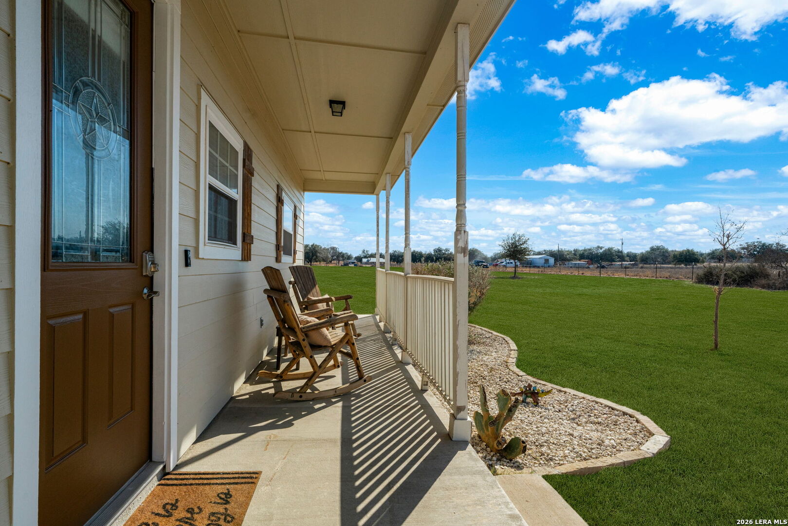 932 County Road 761 Devine, TX 78016 - Photo 8 of 47 a view of a balcony with chair and table