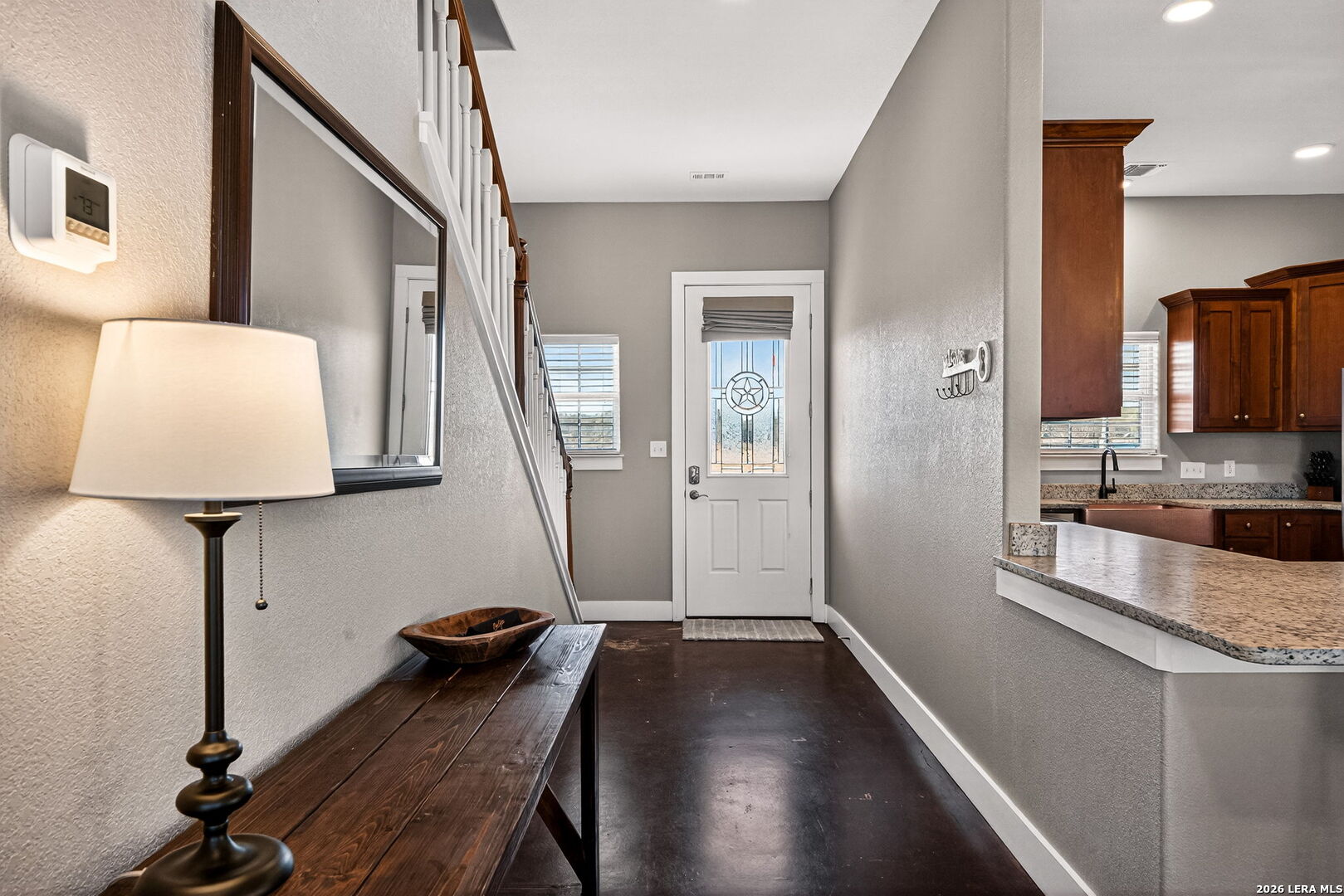 932 County Road 761 Devine, TX 78016 - Photo 9 of 47 a view of a hallway with workspace and a window