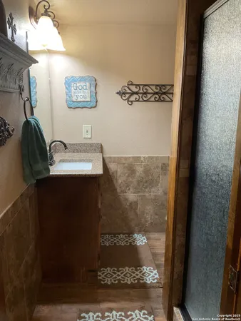 a bathroom with a sink and a mirror