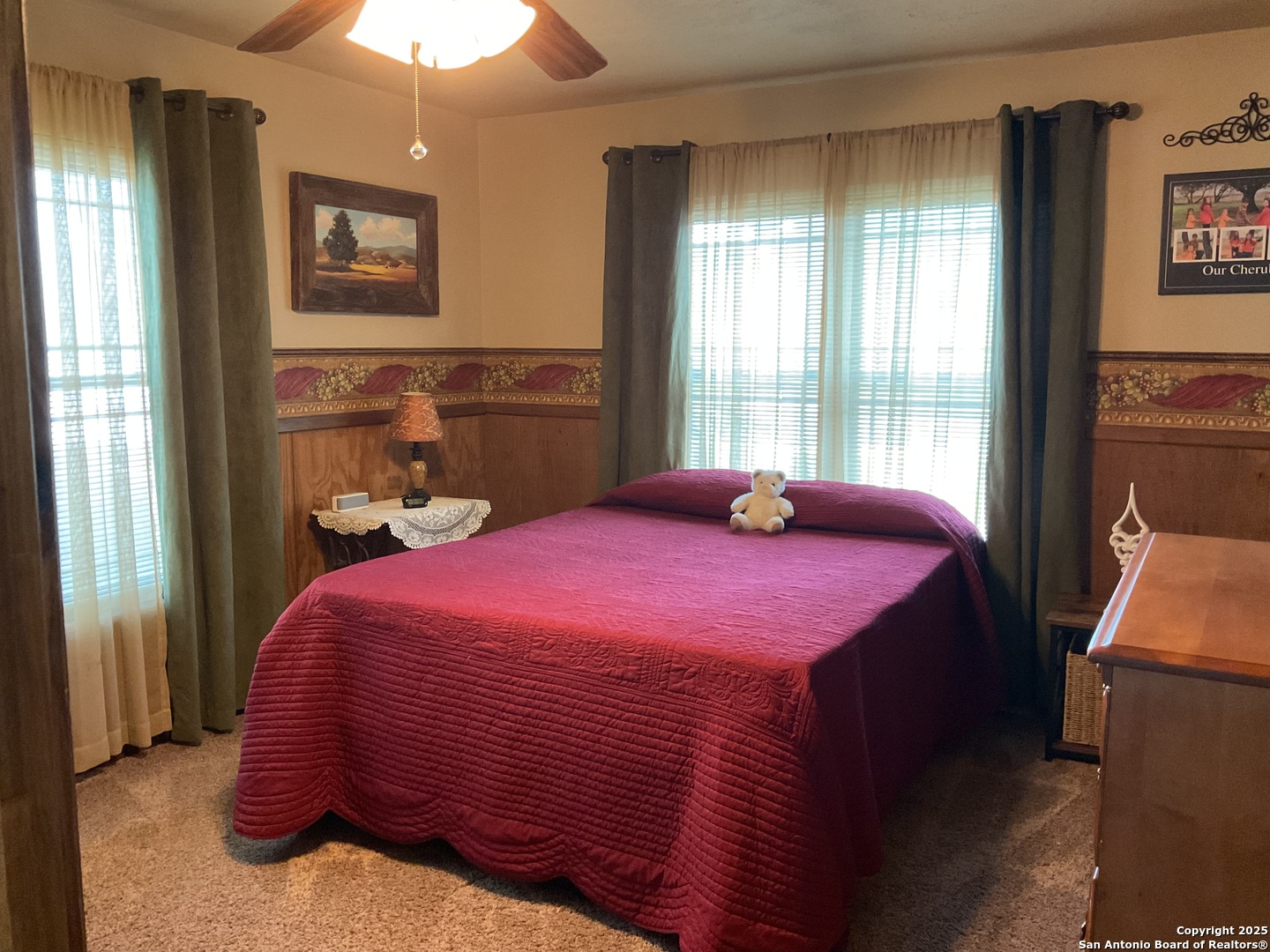 1408 Libold Drive Devine, TX 78016 - Photo 19 of 32 a bedroom with a bed and a window