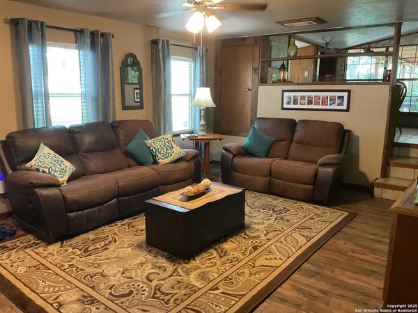 a living room with furniture and a rug