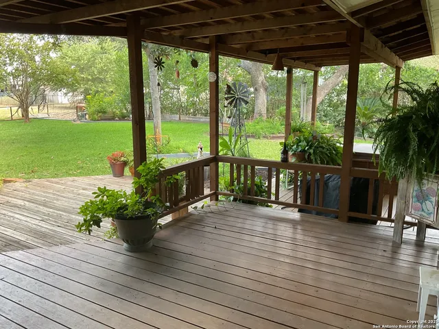 a view of a patio with wooden floor