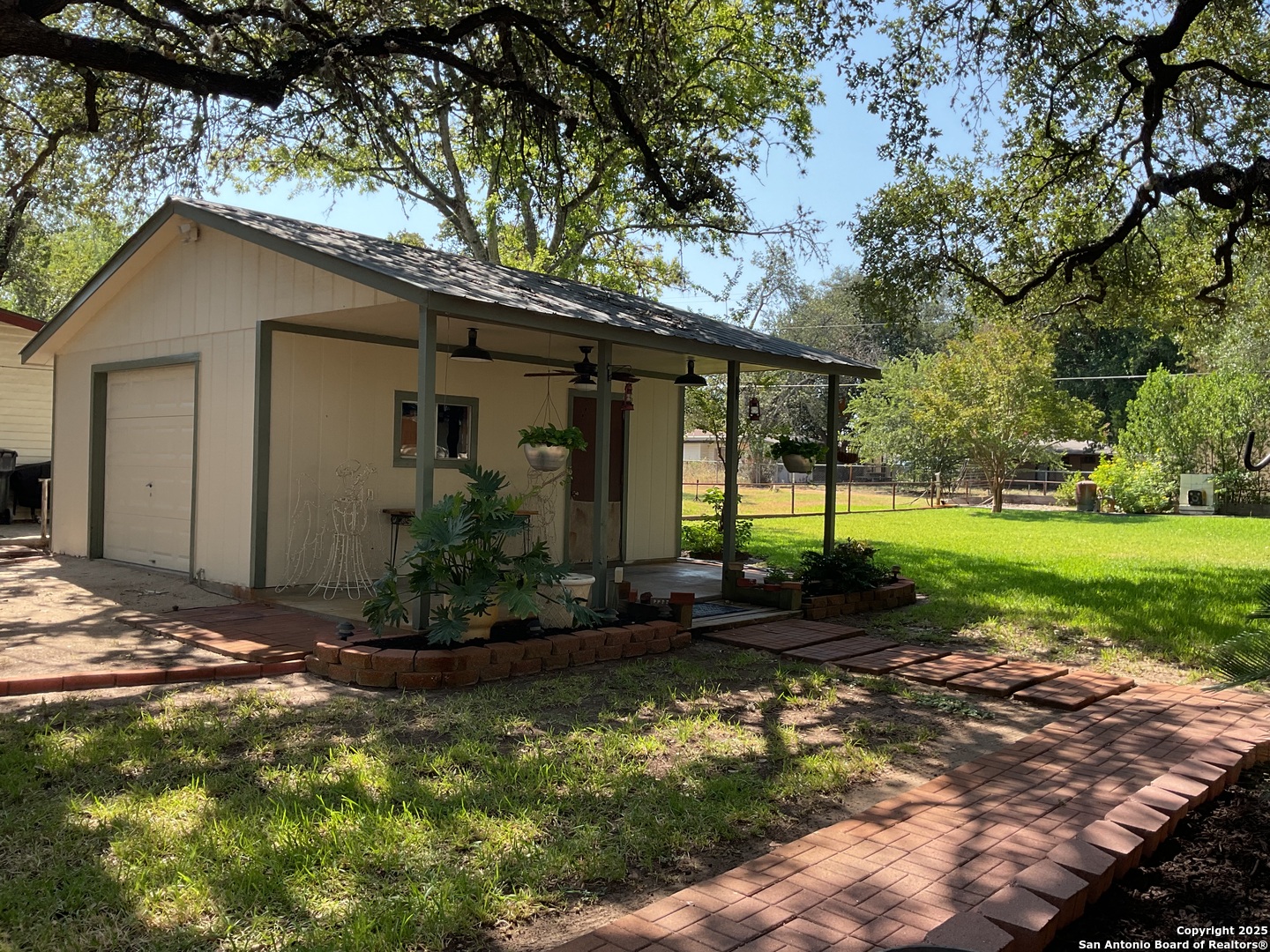 1408 Libold Drive Devine, TX 78016 - Photo 27 of 32 a view of a house with yard and tree s