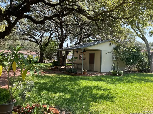 a view of a street with a house in background