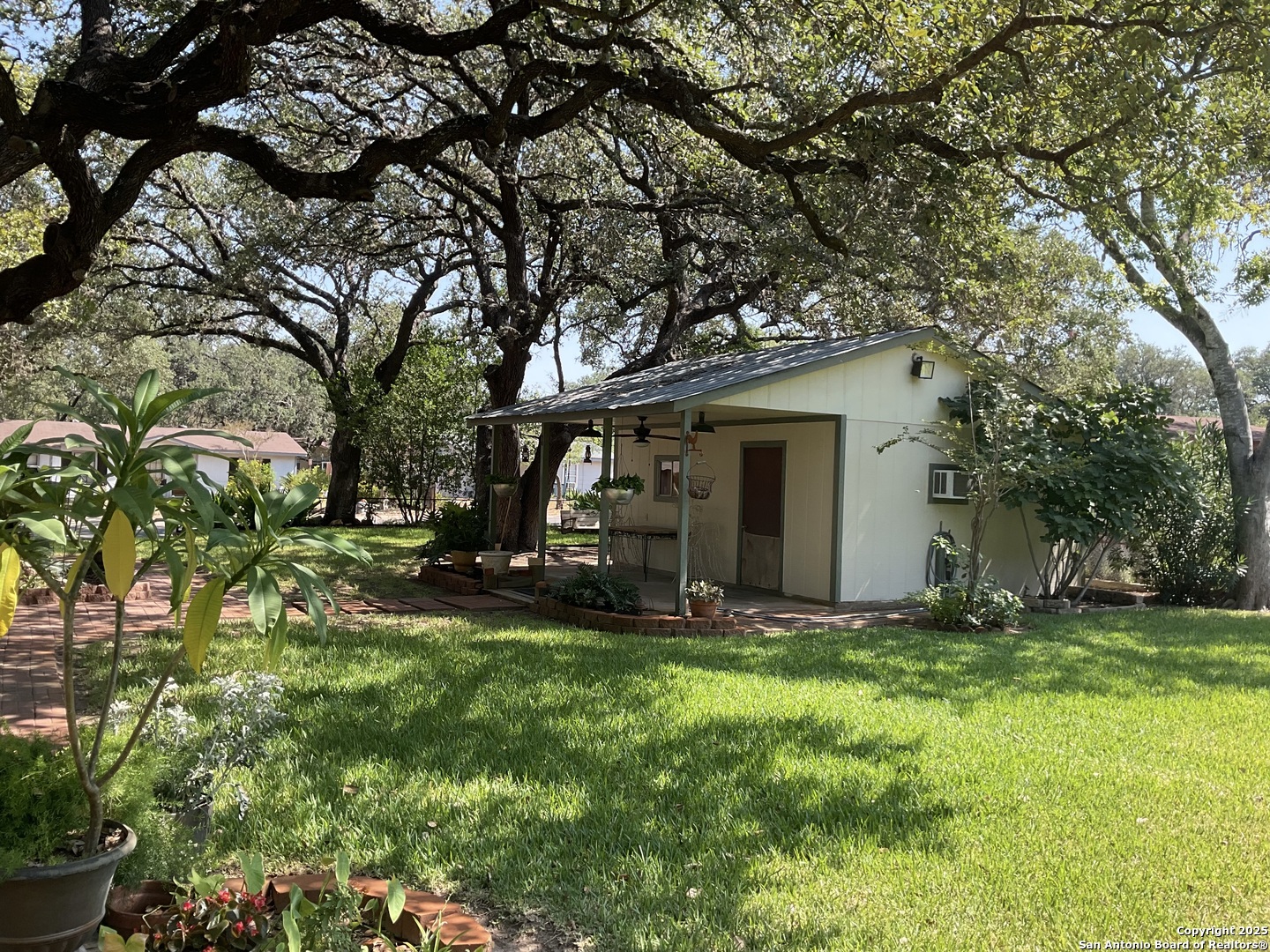 1408 Libold Drive Devine, TX 78016 - Photo 28 of 32 a view of a house with backyard