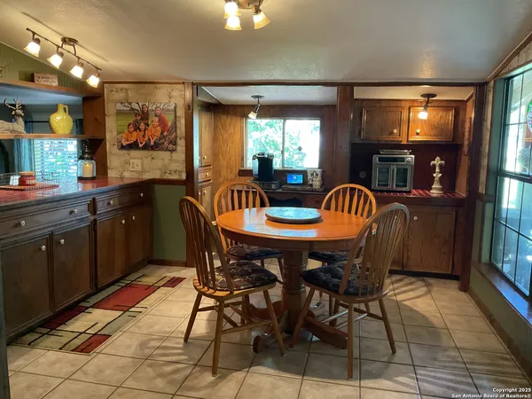 a view of a dining room with furniture and window