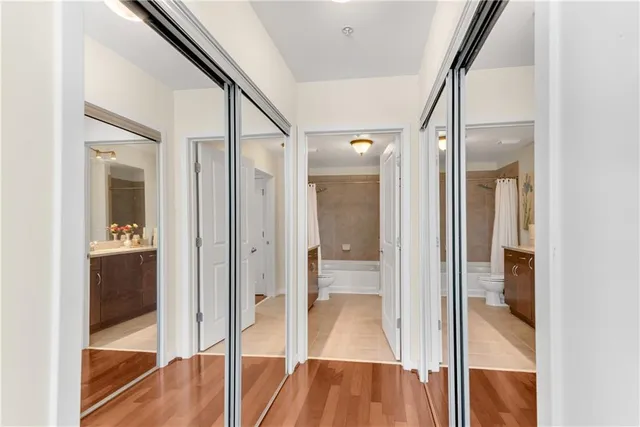 a bathroom with a glass shower door and a glass door