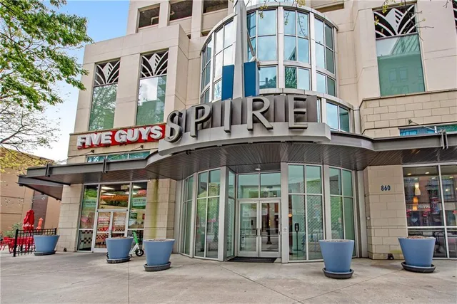 a front view of a building with retail shops