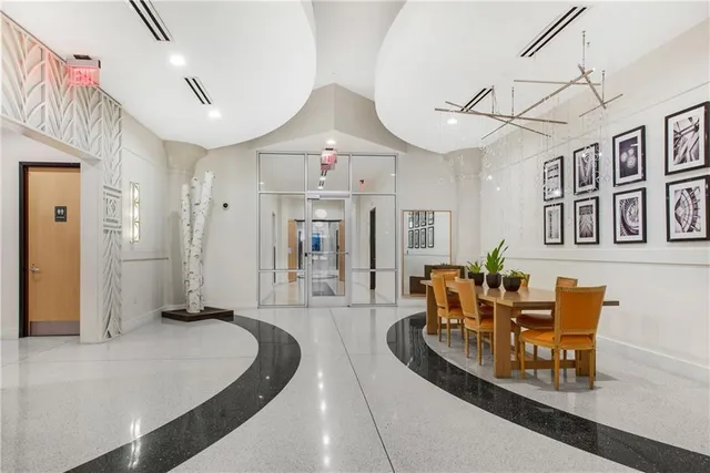 a dining room with furniture and wooden floor