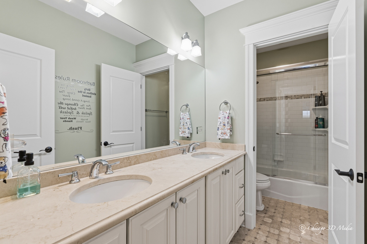 306 17th Street Wilmette, IL 60091 - Photo 33 of 48 a bathroom with a granite countertop sink mirror and shower