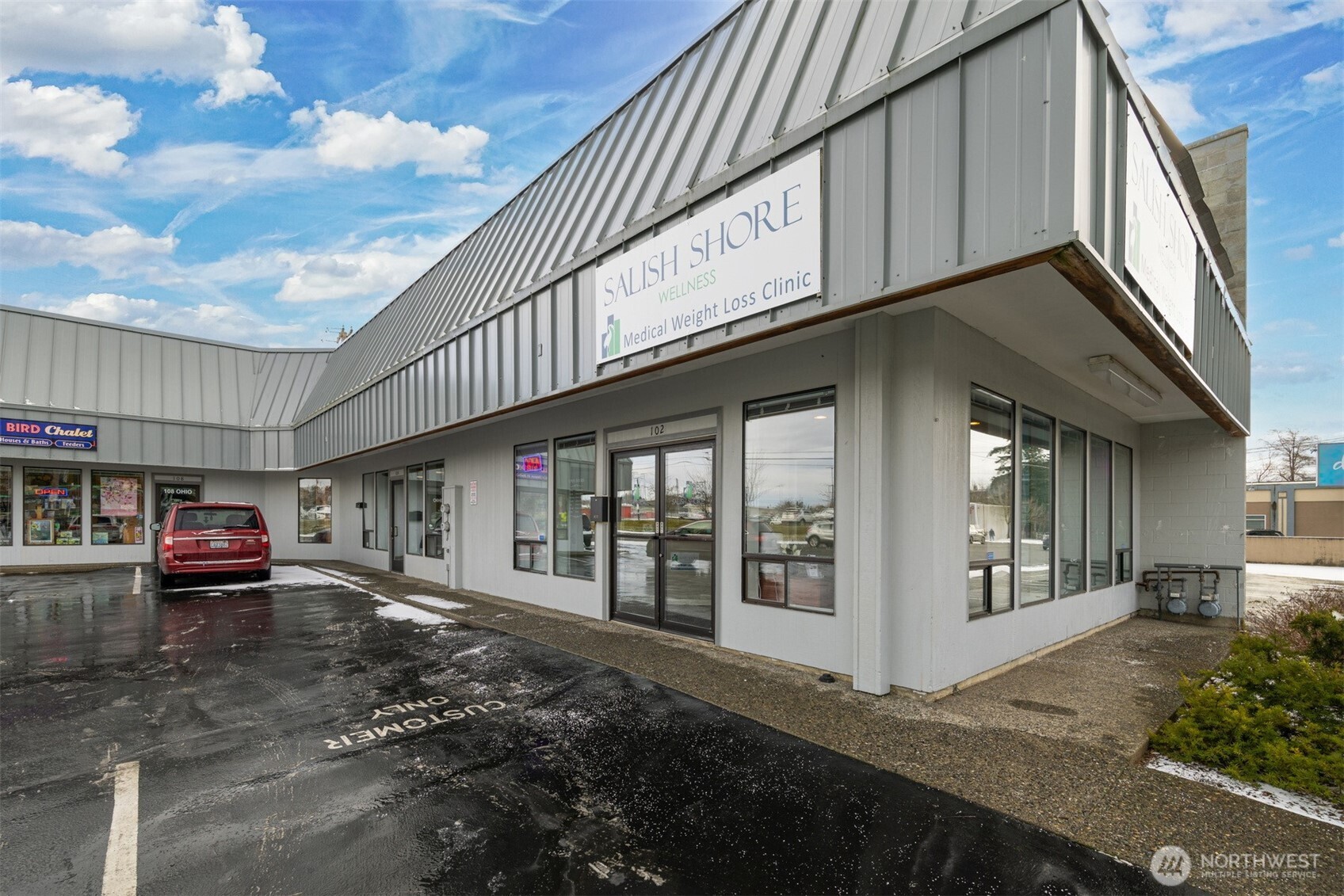 102 Ohio Street, Unit 203 Bellingham, WA 98225 - Photo 2 of 21 a front view of a house with a yard