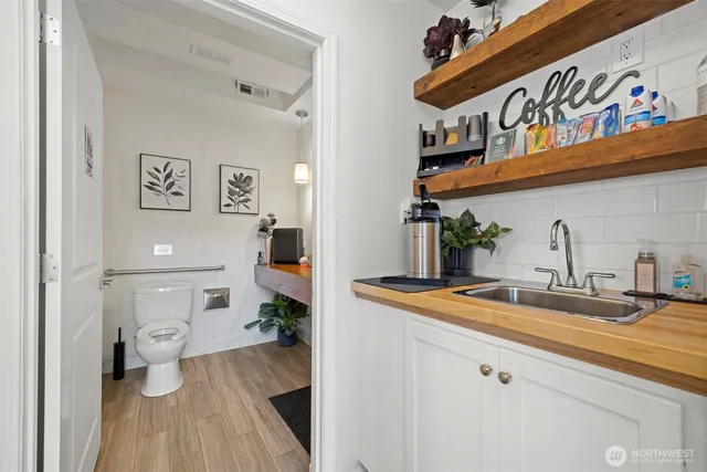 a kitchen with a sink and a refrigerator