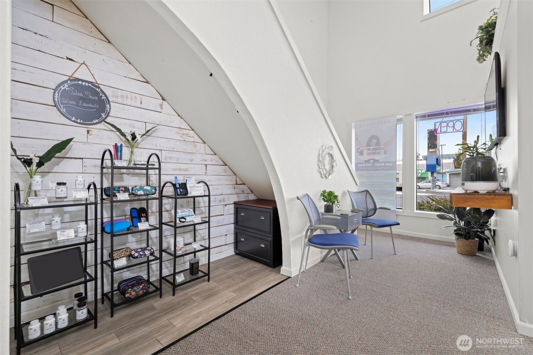 102 Ohio Street, Unit 203 Bellingham, WA 98225 - Photo 10 of 21 a living room with lots of furniture and a chandelier