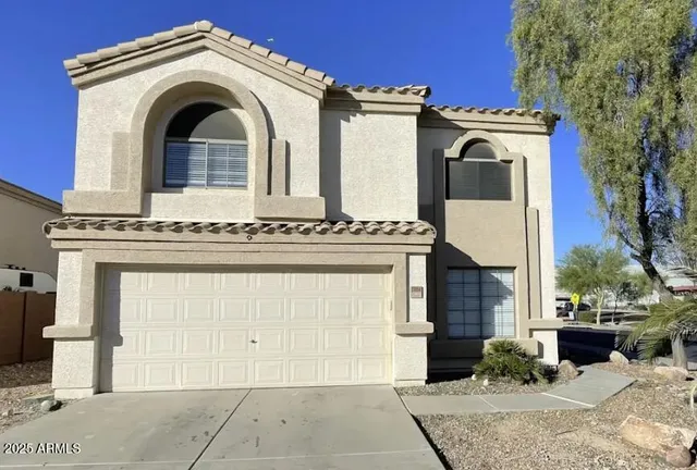 a view of a house with entrance gate