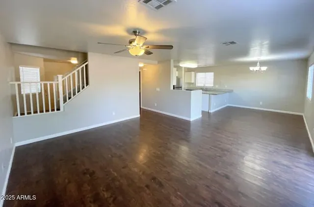 a view of an entryway and wooden floor