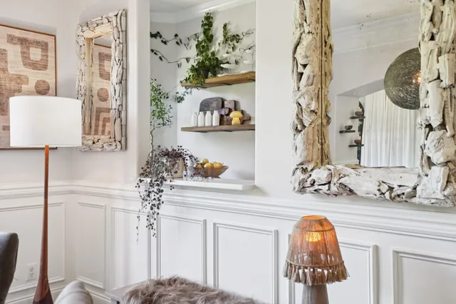 a kitchen with stainless steel appliances granite countertop a sink and wooden floors