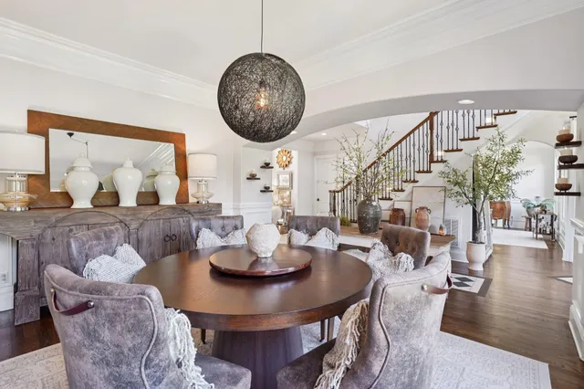 a large kitchen with granite countertop a sink and a wooden floor