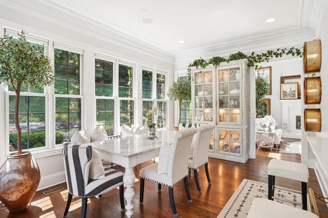 a kitchen with stainless steel appliances granite countertop a stove a refrigerator and a wooden cabinets