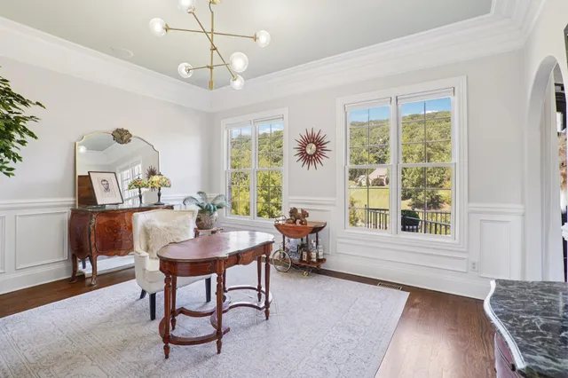 a bathroom with a double vanity sink mirror and bathtub