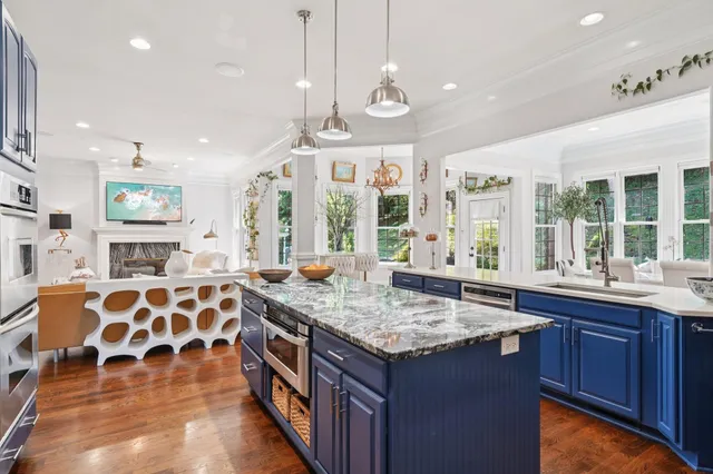 a view of a livingroom with furniture and hardwood floor