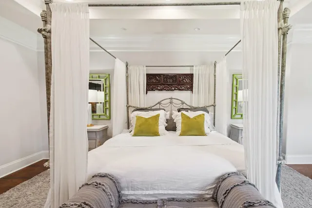 a street view with tall trees