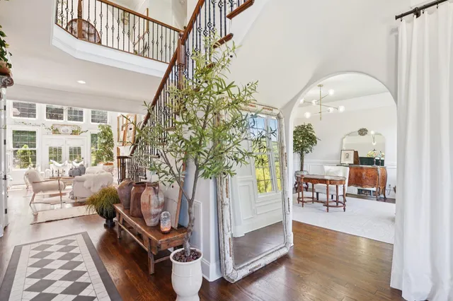 a aerial view of a house next to a yard