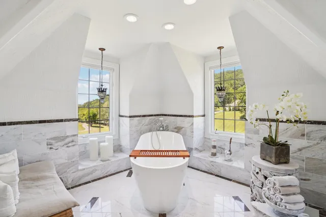 a living room with fireplace furniture and decor