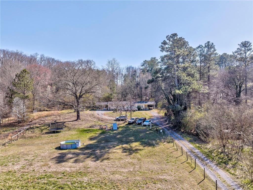 424 Wayside Road Rome, GA 30161 - Photo 14 of 16 a view of a swimming pool and trees in the background