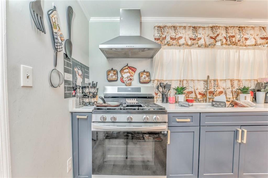 424 Wayside Road Rome, GA 30161 - Photo 3 of 16 a kitchen with stainless steel appliances granite countertop a stove and a sink