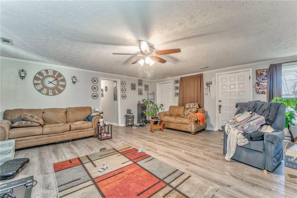 424 Wayside Road Rome, GA 30161 - Photo 5 of 16 a living room with furniture and wooden floor