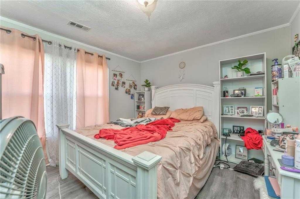 424 Wayside Road Rome, GA 30161 - Photo 7 of 16 a bedroom with a bed and a dresser