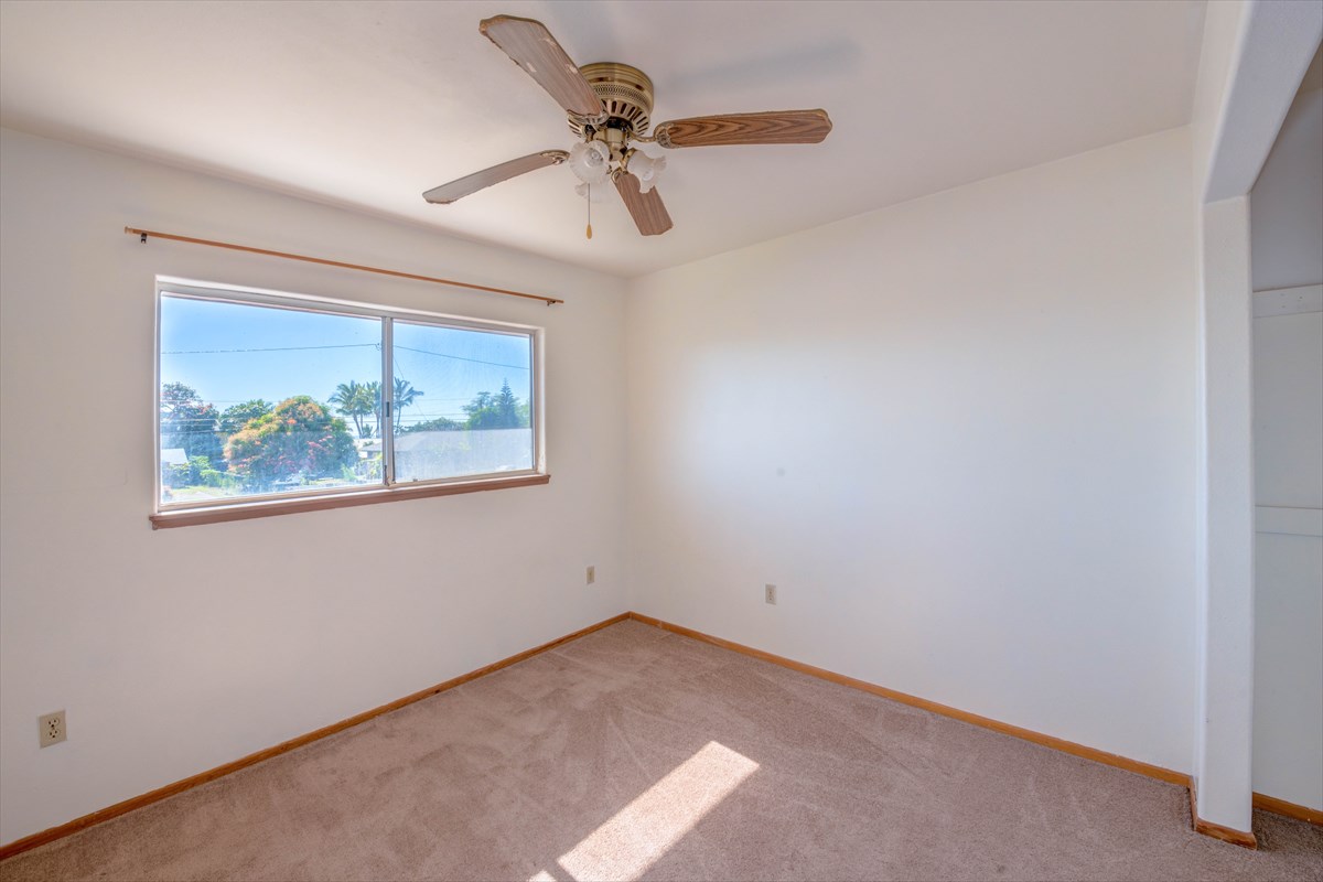 7921 Koae Road Kekaha, HI 96752 - Photo 23 of 25 an empty room with windows and fan