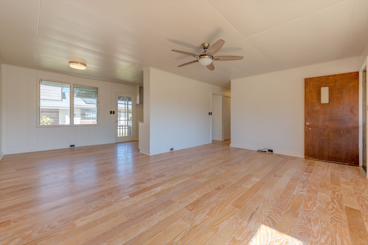 7921 Koae Road Kekaha, HI 96752 - Photo 5 of 25 a view of empty room with wooden floor and fan
