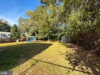 a view of yard with swimming pool