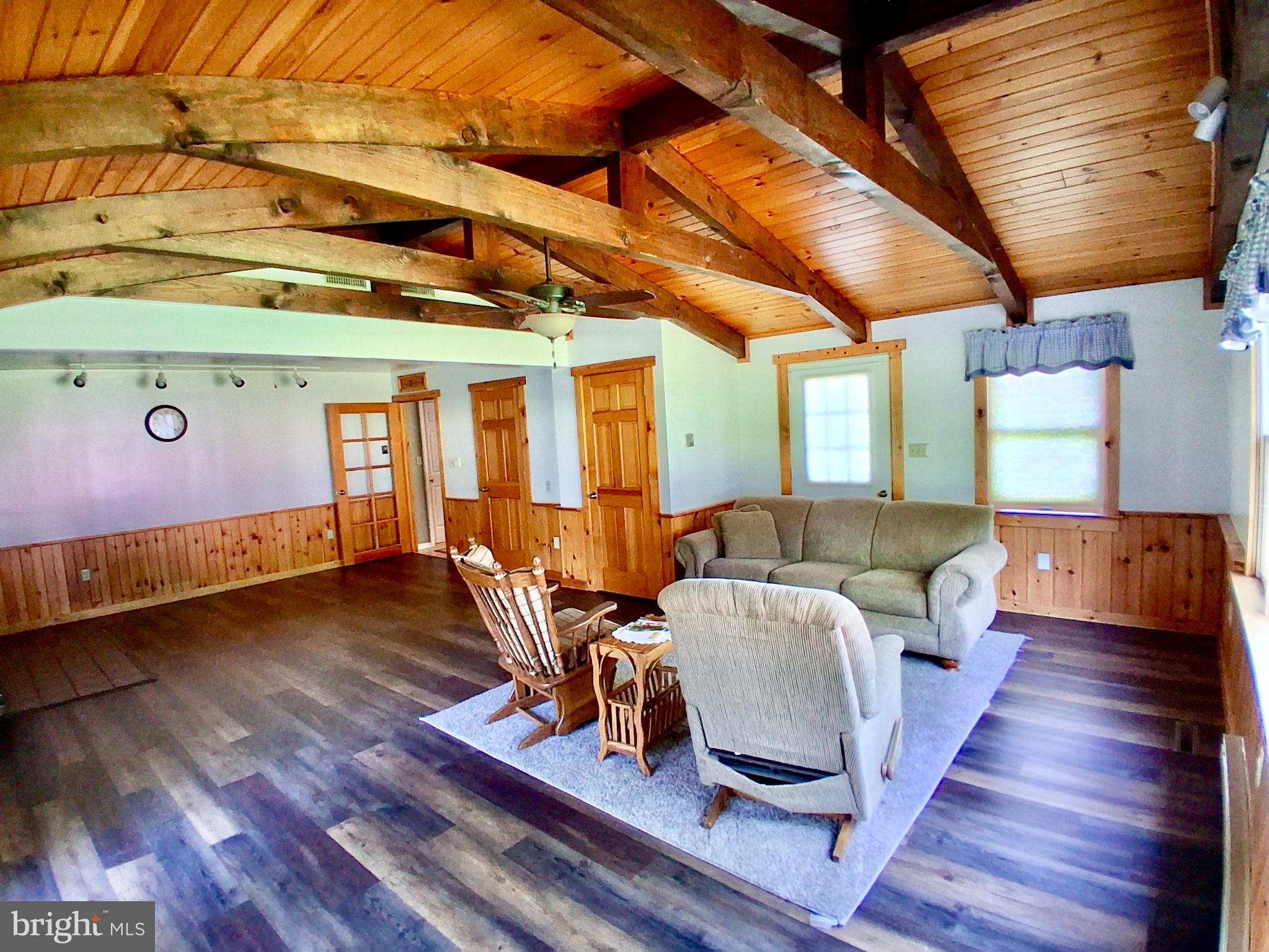9 Buch Mill Road Lititz, PA 17543 - Photo 32 of 39 a living room with furniture a wooden floor and a chandelier