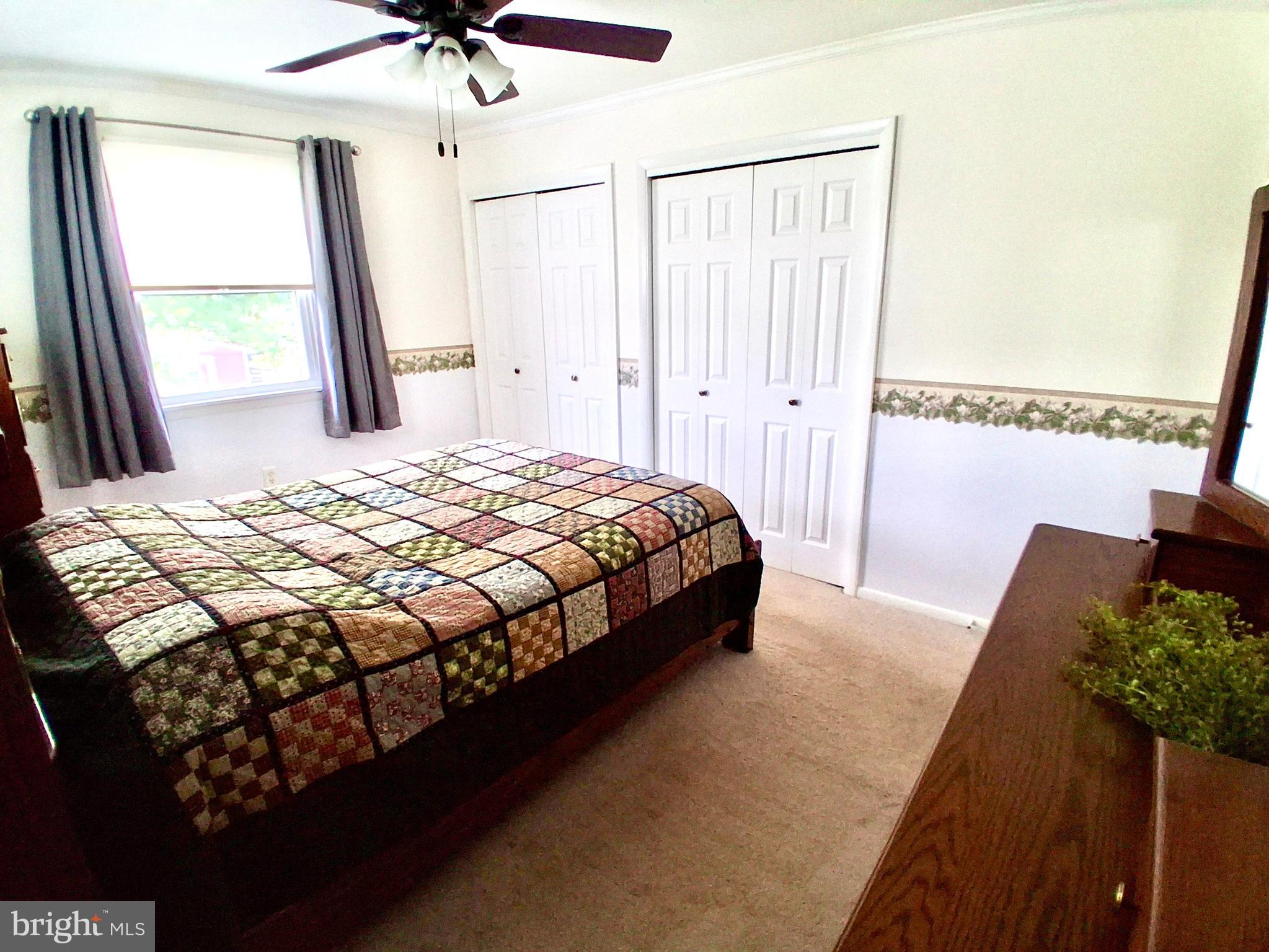 9 Buch Mill Road Lititz, PA 17543 - Photo 35 of 39 a bedroom with a bed chandelier and a window