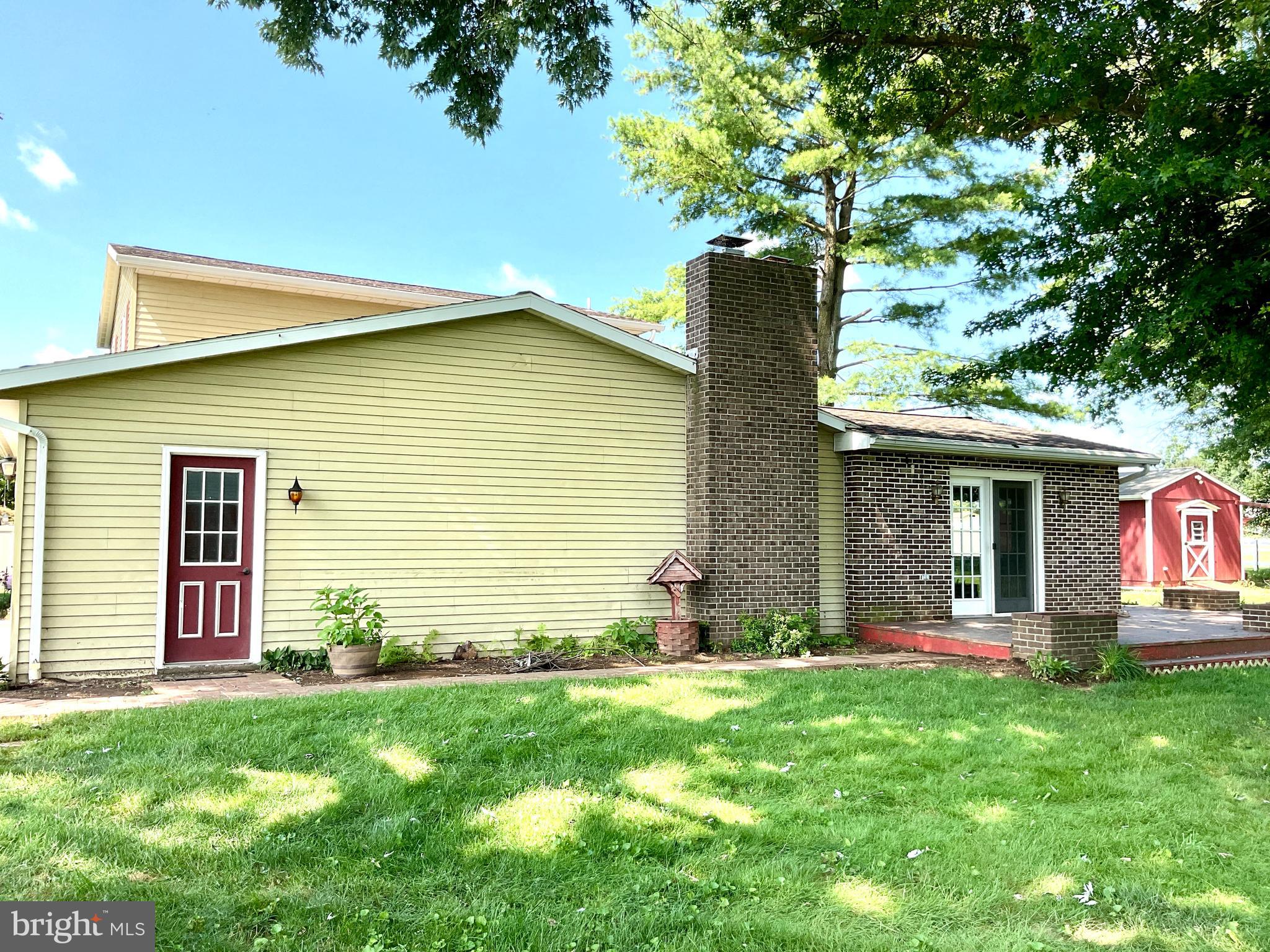 9 Buch Mill Road Lititz, PA 17543 - Photo 4 of 39 a front view of a house with a yard and garage