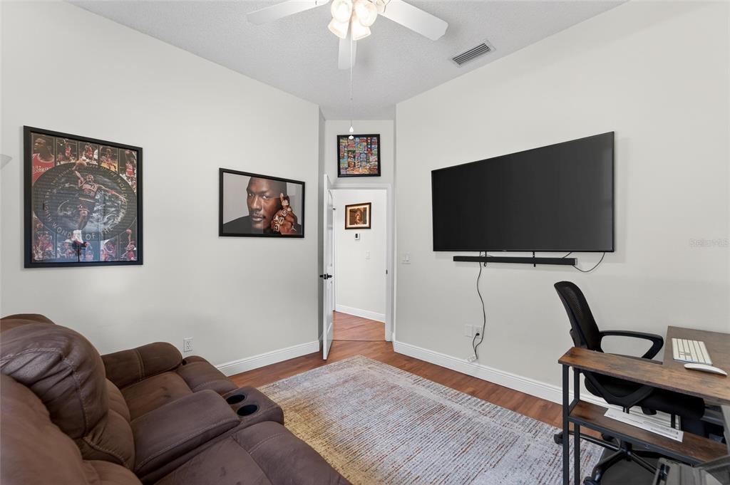3522 Fox Squirrel Lane Valrico, FL 33596 - Photo 56 of 82 a living room with furniture and a flat screen tv
