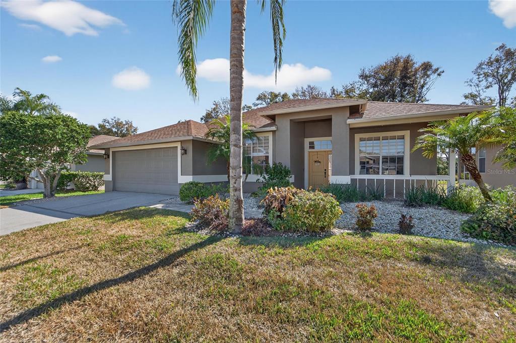 3522 Fox Squirrel Lane Valrico, FL 33596 - Photo 6 of 82 a front view of house with yard and trees around