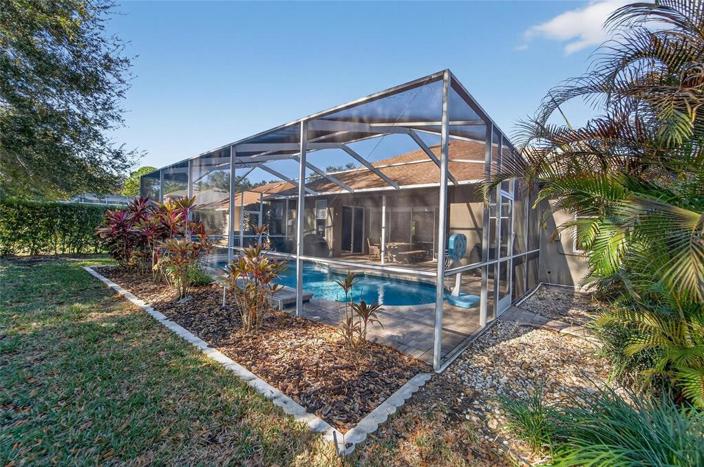 3522 Fox Squirrel Lane Valrico, FL 33596 - Photo 63 of 82 a view of a house with a small yard and sitting area