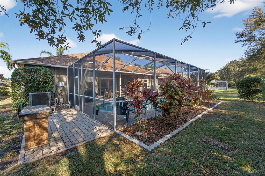 3522 Fox Squirrel Lane Valrico, FL 33596 - Photo 64 of 82 a view of a chairs and table in backyard of the house