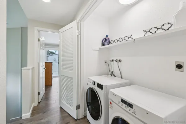 a view of a storage & utility room with a washer dryer