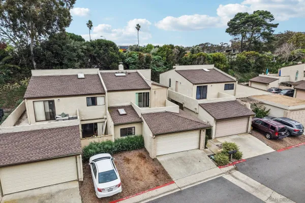 an aerial view of a house with a garden
