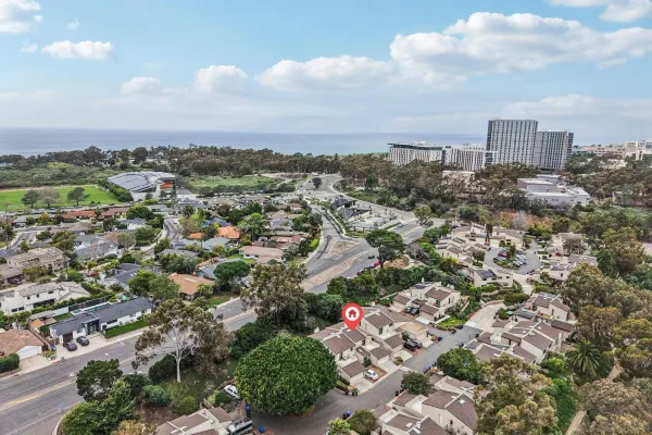 an aerial view of a house with outdoor space and street view