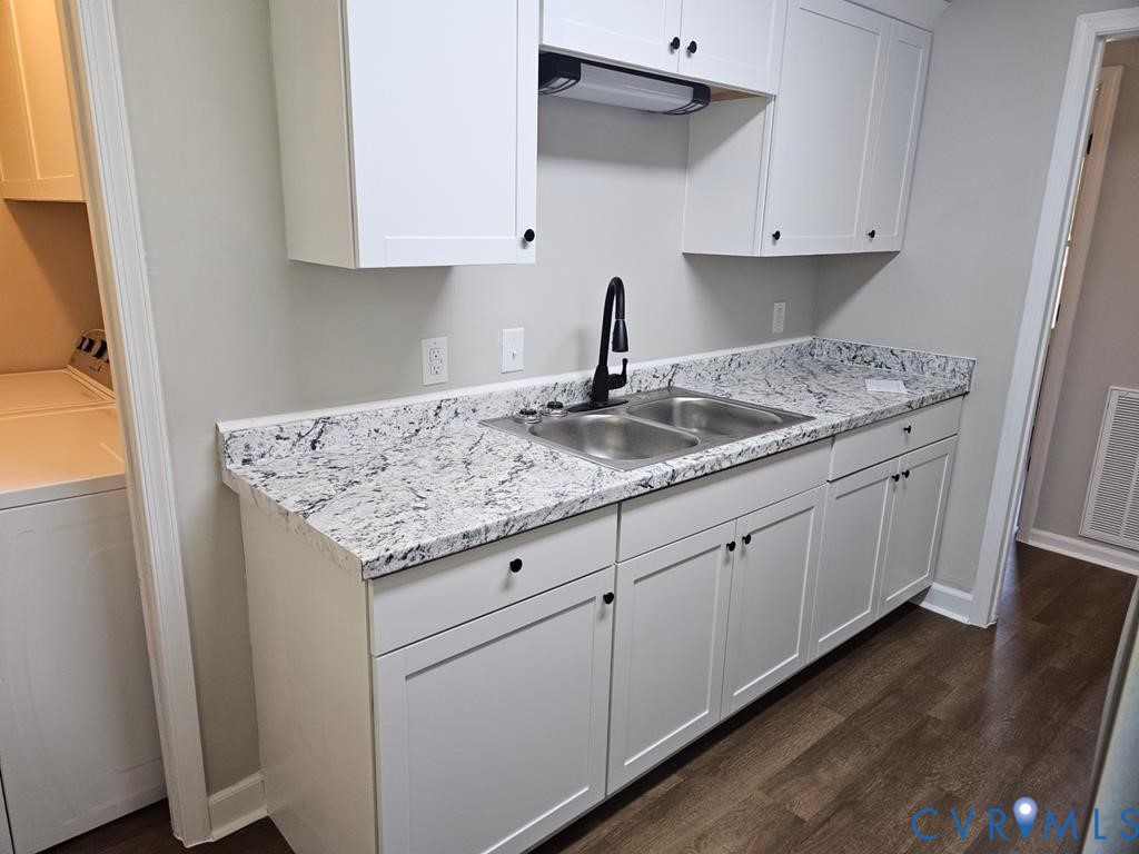 27368 Prince Edward Highway Rice, VA 23966 - Photo 5 of 18 a kitchen with granite countertop white cabinets and a sink