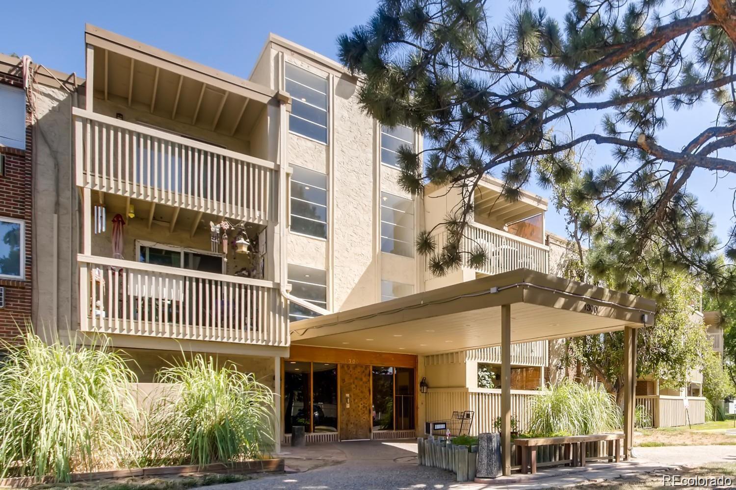 1302 South Parker Road, Unit 229 Denver, CO 80231 - Photo 15 of 18 a view of a house with a tree